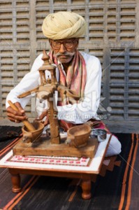 stock-photo-17431543-indian-man-during-opium-ceremony-rajasthan-india[2]